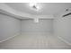 Finished basement room with light gray walls and carpet at 109 Aspenridge Dr, Holly Springs, NC 27540