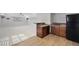 Basement kitchenette with dark wood cabinets and flooring at 109 Aspenridge Dr, Holly Springs, NC 27540