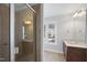 Bathroom with shower, double vanity, and window at 109 Aspenridge Dr, Holly Springs, NC 27540