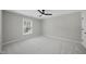 Cozy carpeted bedroom with a large window at 109 Aspenridge Dr, Holly Springs, NC 27540