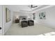 Spacious bedroom with carpeted floors and ceiling fan at 109 Aspenridge Dr, Holly Springs, NC 27540
