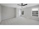 Bright bedroom with carpet, ceiling fan, and two windows at 109 Aspenridge Dr, Holly Springs, NC 27540