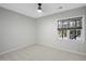 Simple bedroom with carpet, one window, and neutral walls at 109 Aspenridge Dr, Holly Springs, NC 27540