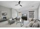 Bonus room with seating area, large windows, and ceiling fan at 109 Aspenridge Dr, Holly Springs, NC 27540