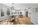 Bright kitchen with island, stainless steel appliances, and eat-in area at 109 Aspenridge Dr, Holly Springs, NC 27540