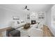 Spacious living room features a fireplace and built-in shelving at 109 Aspenridge Dr, Holly Springs, NC 27540