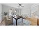 Cozy office space features hardwood floors, neutral walls, a ceiling fan, and ample natural light at 109 Aspenridge Dr, Holly Springs, NC 27540