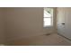 A bright room with unfinished floors and a window at 1105 Opal Ln # 70, Durham, NC 27705