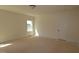 A bedroom featuring light-colored walls, base trim, carpeted floor and one double hung window at 1105 Opal Ln # 70, Durham, NC 27705