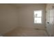 A bright room with unfinished floors and a window at 1105 Opal Ln # 70, Durham, NC 27705
