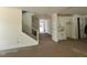 Spacious foyer featuring a staircase, built-in cabinets, and a view of the front door at 1105 Opal Ln # 70, Durham, NC 27705