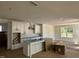 Bright, white kitchen featuring a kitchen island, modern finishes, and stainless-steel appliances at 1105 Opal Ln # 70, Durham, NC 27705