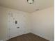An open room featuring wood floors and paneled double doors at 1105 Opal Ln # 70, Durham, NC 27705