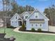 Curb appeal abounds at this charming two-story home at 1205 Smith Creek Way, Wake Forest, NC 27587