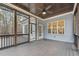 Screened porch with wood-paneled ceiling, fan, and view of backyard at 1205 Smith Creek Way, Wake Forest, NC 27587