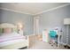 Cozy bedroom with a built-in desk and plenty of natural light at 128 Bruce Dr, Cary, NC 27511