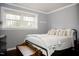 Bedroom with a bed, window, and hardwood floor at 128 Bruce Dr, Cary, NC 27511