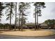 Community clubhouse surrounded by mature trees at 128 Bruce Dr, Cary, NC 27511