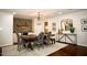 Formal dining room with chandelier and stone accent wall at 128 Bruce Dr, Cary, NC 27511