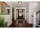 Elegant entryway with hardwood floors and a large mirror at 128 Bruce Dr, Cary, NC 27511