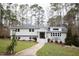 White charming one-story home with a well-manicured lawn at 128 Bruce Dr, Cary, NC 27511