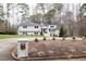 Ranch home with gray siding, landscaping, and circular driveway at 128 Bruce Dr, Cary, NC 27511
