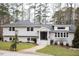 Charming ranch home with gray siding and landscaping at 128 Bruce Dr, Cary, NC 27511