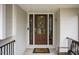 Elegant dark brown front door with glass panels and a wreath at 128 Bruce Dr, Cary, NC 27511