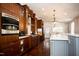 Well-equipped kitchen with dark wood cabinets and granite countertops at 128 Bruce Dr, Cary, NC 27511