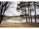 Scenic lake view with geese and mature trees at 128 Bruce Dr, Cary, NC 27511