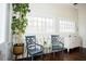 Cozy sitting area with two armchairs and a view to the backyard at 128 Bruce Dr, Cary, NC 27511