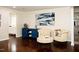 Sitting room with blue cabinet, comfy armchairs, and hardwood floors at 128 Bruce Dr, Cary, NC 27511