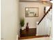 Elegant staircase with hardwood floors and white railings at 128 Bruce Dr, Cary, NC 27511