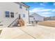 Large backyard with patio, steps, and partial home view at 148 Aylebury Rdg, Zebulon, NC 27597