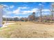 Open backyard with grassy area and tree line at 148 Aylebury Rdg, Zebulon, NC 27597