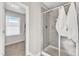 Clean bathroom with a walk-in shower and window at 148 Aylebury Rdg, Zebulon, NC 27597
