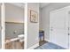 Convenient half bathroom with gray walls and wood-look flooring at 148 Aylebury Rdg, Zebulon, NC 27597