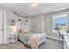 Cozy bedroom with a twin bed, desk, and window view at 148 Aylebury Rdg, Zebulon, NC 27597