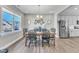 Dining area with wooden table and chairs, open to kitchen at 148 Aylebury Rdg, Zebulon, NC 27597