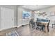 Dining room with a wooden table, black chairs, and a view to the kitchen at 148 Aylebury Rdg, Zebulon, NC 27597