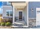 Dark brown front door with stone and siding accents at 148 Aylebury Rdg, Zebulon, NC 27597