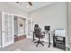 Bright home office with standing desk, comfortable chair, and French doors at 148 Aylebury Rdg, Zebulon, NC 27597