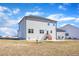 Gray house with wooden back steps and patio, in a yard with patchy grass at 148 Aylebury Rdg, Zebulon, NC 27597