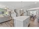 Open kitchen island view, with living room and stairs visible at 148 Aylebury Rdg, Zebulon, NC 27597