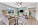 Living room with hardwood floors, a large window, and comfy seating at 148 Aylebury Rdg, Zebulon, NC 27597