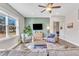 Living room with hardwood floors, a green accent wall, and comfortable seating at 148 Aylebury Rdg, Zebulon, NC 27597