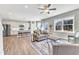 Open floor plan with hardwood floors, modern kitchen, and ample natural light at 148 Aylebury Rdg, Zebulon, NC 27597