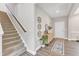 Modern staircase with carpeted steps and a wood handrail at 148 Aylebury Rdg, Zebulon, NC 27597