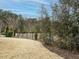 Landscaped backyard with a privacy fence at 1908 Cypress Cove Dr, Wendell, NC 27591