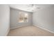 Spacious bedroom featuring a ceiling fan and window at 1920 Lost Ln, Raleigh, NC 27603